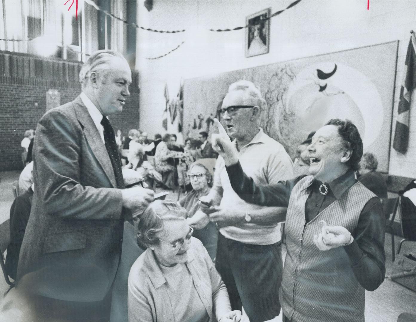 Running for Re-Election, East York Mayor Willis Blair drops in on senior citizens in the Cedarvale Park building, where Neil Whitten (right) of Preste(...)