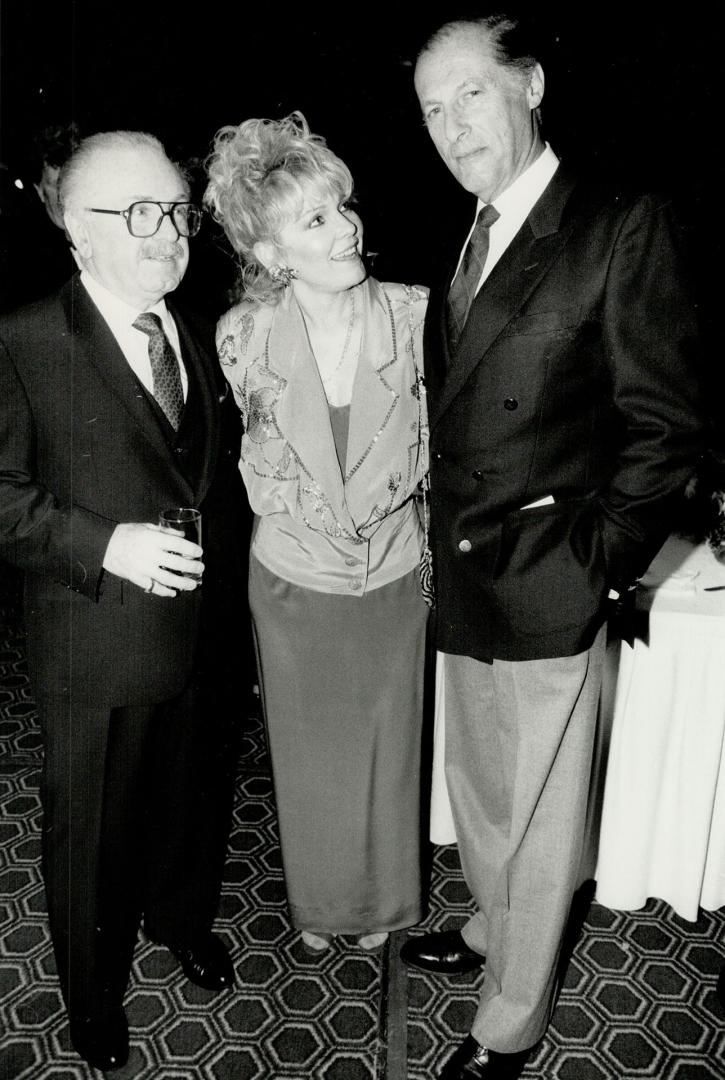 CBS Records marketing director Charles Camilleri, left, meets actress Patty Weaver of The Young and The Restless and actor Lloyd Bochner