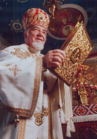 Bishop Isidore Borecky prepares for Christmas Mass at the Ukrainian Catholic Toronto chancery office, as Ukrainians celebrate the birth of Christ and their nation