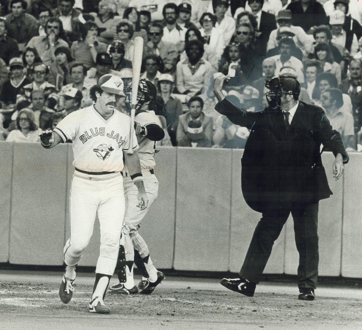 Jay's Rick Bosetti flips bat away angrily after striking out against crafty Yankee veteran Luis Tiant