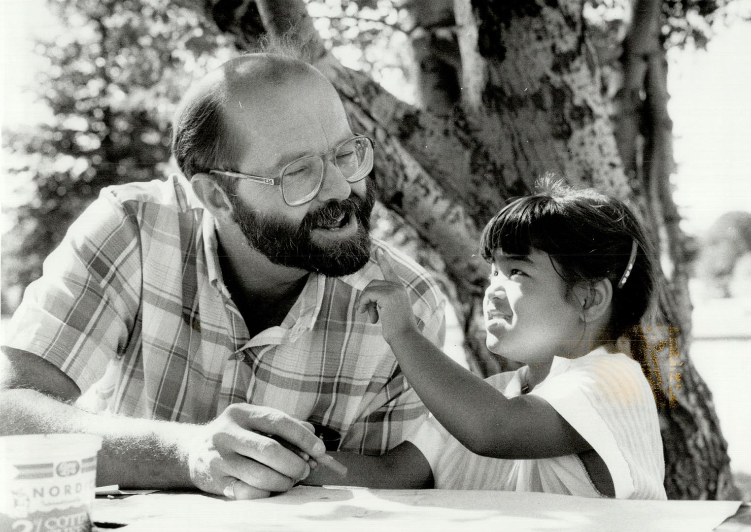 Image shows a Seven-year-old Jennifer is intrigued by a politician John Bosley's beard during a…