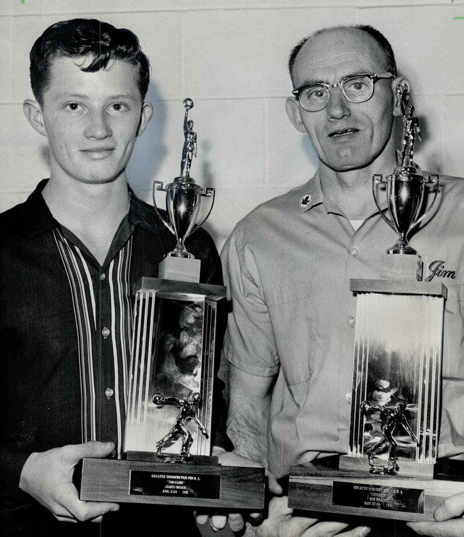 Bobby Brace, who bowled two perfect games last year, and his father, Jim Brace, manager of Cedar Brae Bowl, receive trophies for high 700 triples