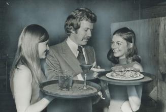 Pretty girls are an attraction in the restaurant-pub business, but Roel Bramer, pictured above with two of his employees, steers away from the Bunny C(...)