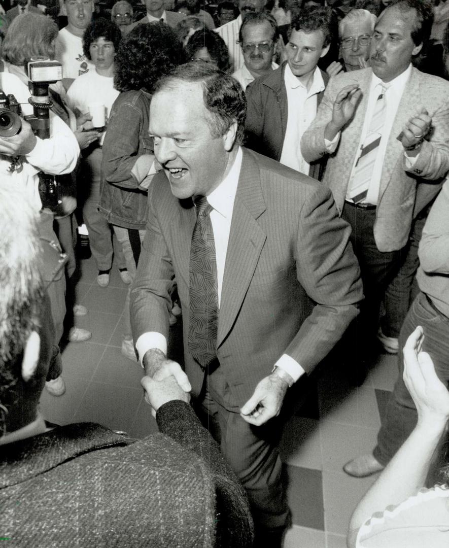 Victory Parade: Mike Breaugh makes a triumphal entry to his Oshawa headquarters last night after winning a by-election