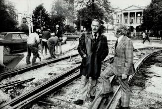 Works Commissioner Ray Bremner, shown above (dark coat) with Bill McKinnon, senior project engineer