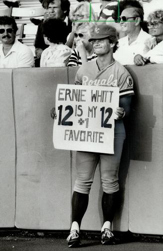 Really, George? Royals' George Brett borrowed a fan's sign to clown around before last night's game against Blue