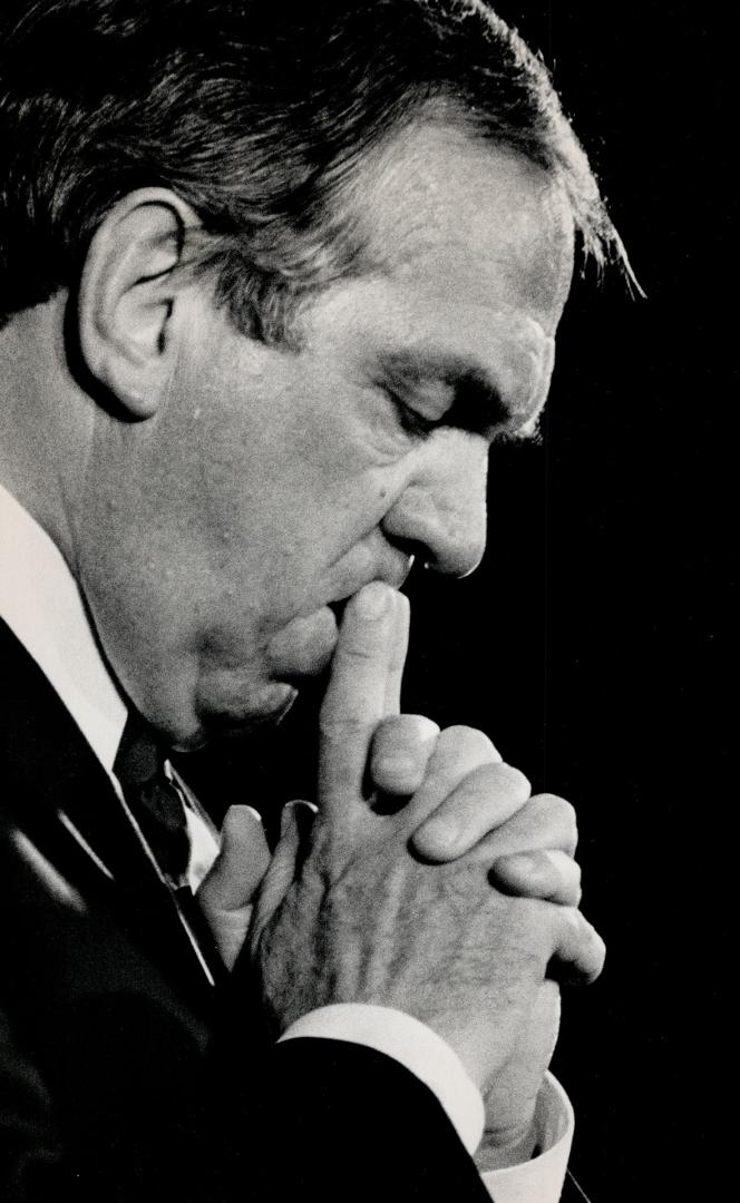 Gathering his thoughts: At left, Broadbent pauses to reflect during a speech at an Edomonton rally