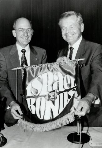 Bond Between nations: Charles Bronfman, left, and Melvin Dobrin introduce new Israel bond issue aimed at helping settle immigrants