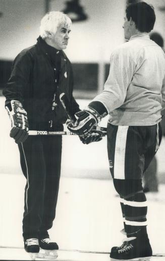 Now hear this, Second: Maple Leafs coach John Brophy, who hasn't been at all happy with the non-belligerent play of his charges lately, has a word with Al Second at practice yesterday