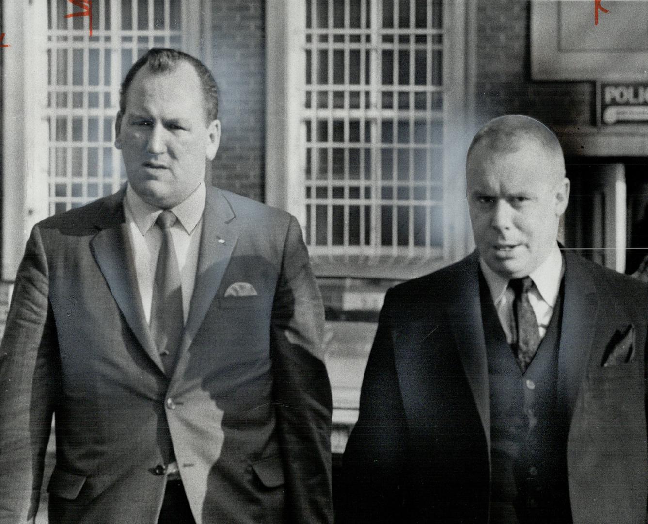 Syd Brown, left, of Toronto Police Association, leaves police headquarters with lawyer John Kerr after the two had sat in on inquiry into charges that(...)