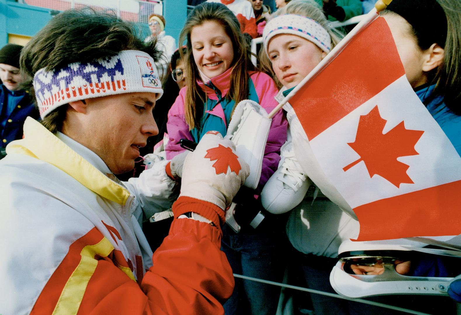 Sign on the dotted . . . skate? Kurt Browning autographs skate of Michelle Markson, 13, at Harbourfront rally to introduce Olympic figure skating squad