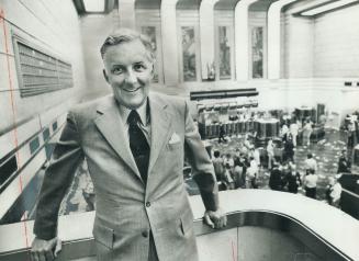 Surveying his new territory, Pearce Bunting, 47, who takes over July 1 as president of Toronto Stock Exchange, leans on parapet of visitors' gallery, (...)