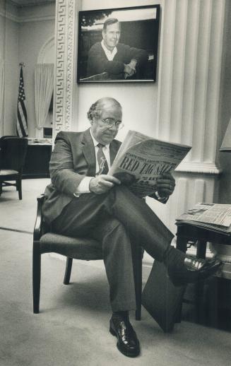 Halls of power: Burney catches up on his reading while waiting to meet with Michael Boskin, chairman of President George Bush's council of economic advisers