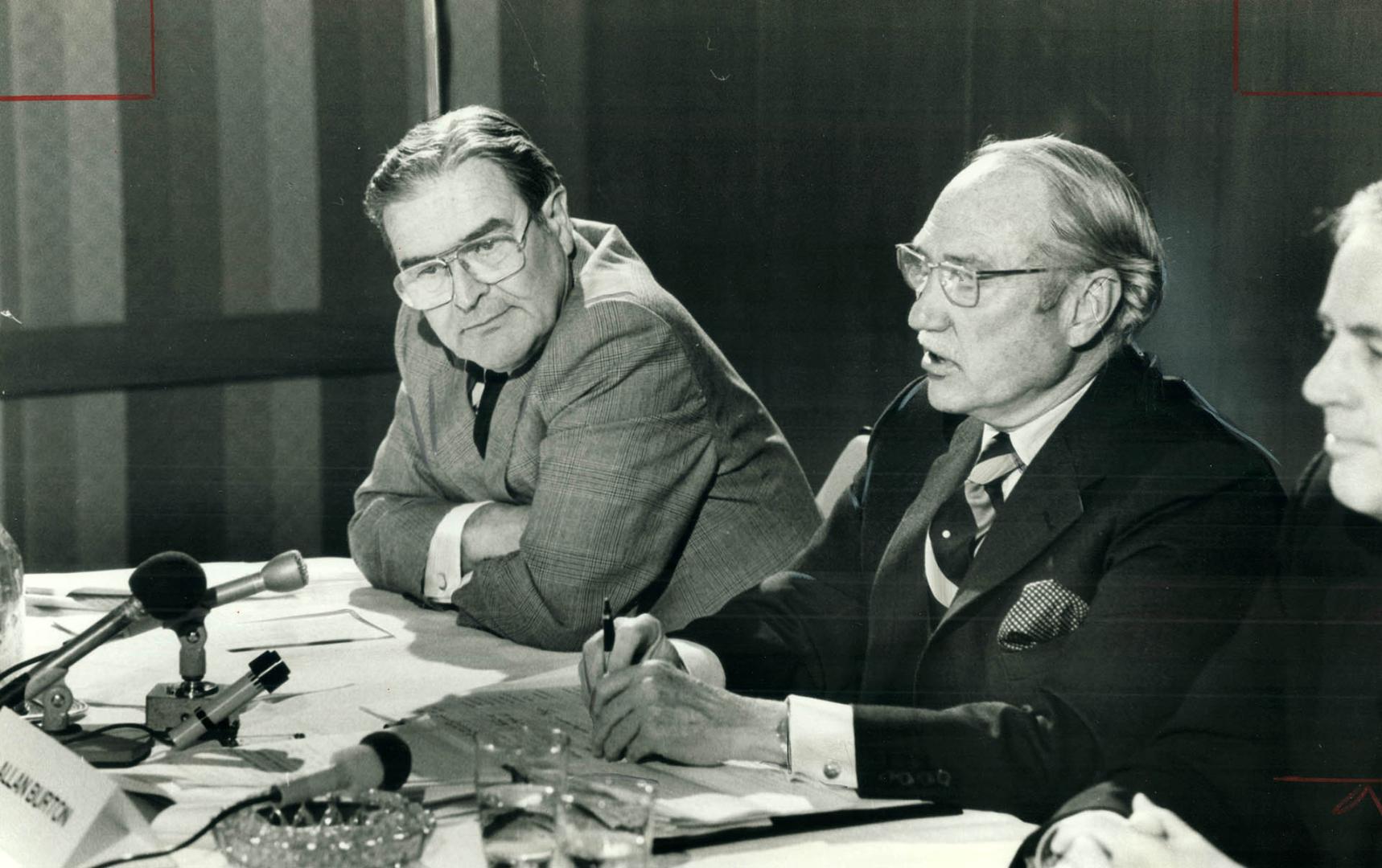 Jack Barrow, left, listens as G