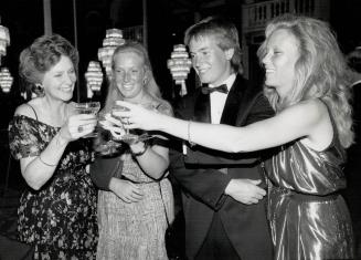 Gala chairman Jane Burton, left, is congratulated by her children