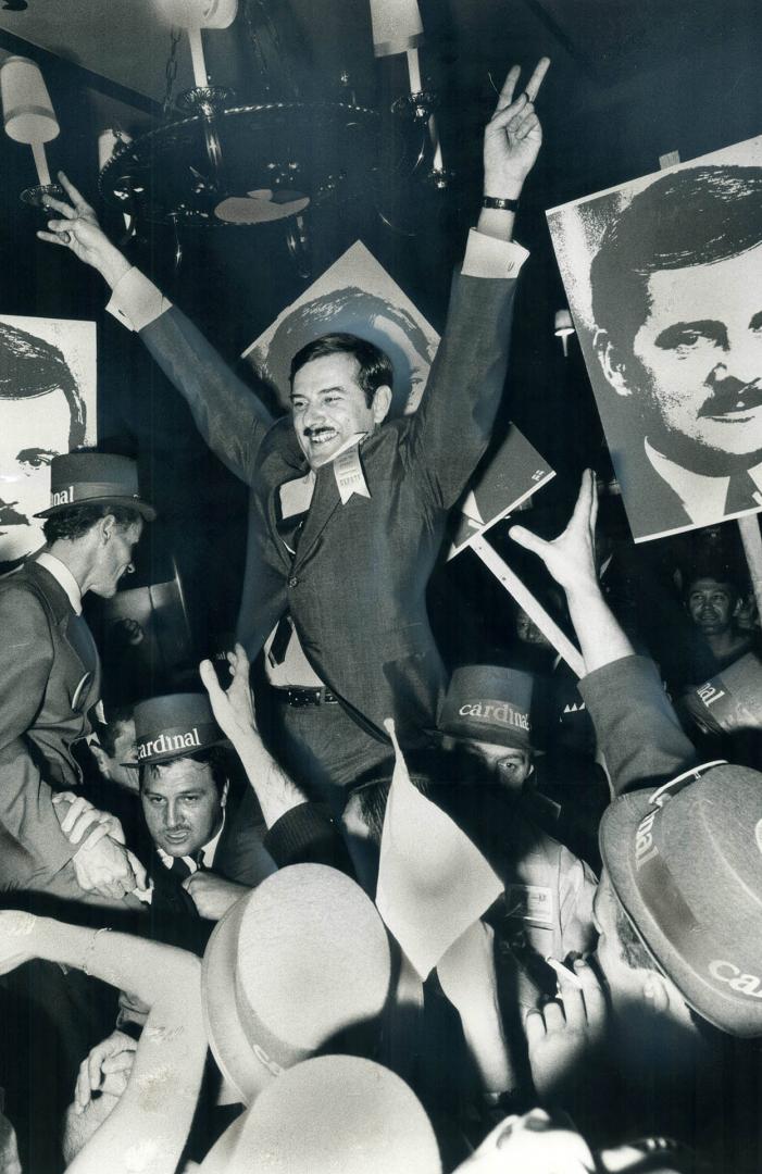 Inside the coliseum supporters of Quebec Education Minister Jean-Guy Cardinal, chief opponent of Premier Jean-Jacques Bertrand, lift him aloft after h(...)