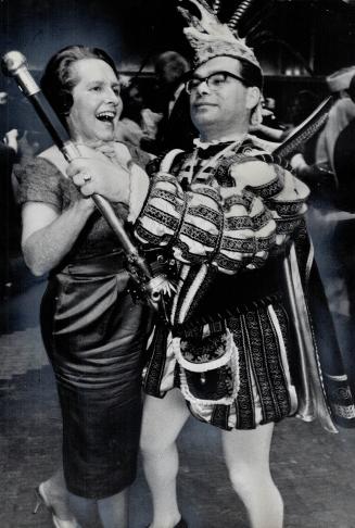 Controller leads 'EM a dance. Controller Mrs. Margaret Campbell whirls on to the dance floor with partner Joseph Littlejohn at the 1965 Nationbuilders(...)