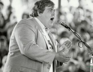 Comedian John Candy was co-host