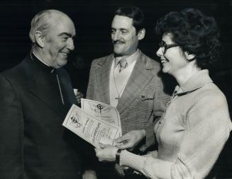 Archbishop Emmett Carter talks to Cursillo leaders Loui9s and Dolores Duhault