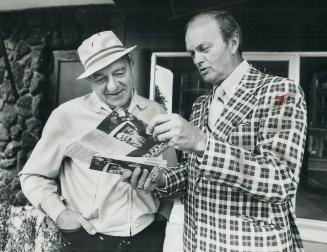 Tory Maurice Carter (right), shown seeking vote of Alfred Revell, is trying to unseat Liberal leader Stuart Smith in Hamilton West riding in Thursday'(...)