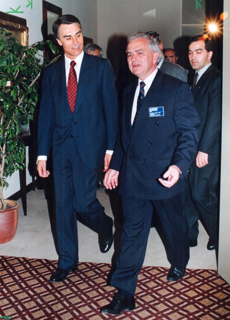 Business for breakfast. Portuguese Prime Minister Anibal Cavaco Silva, left, and Metro Board of Trade president Donald King arrive at breakfast meeting today