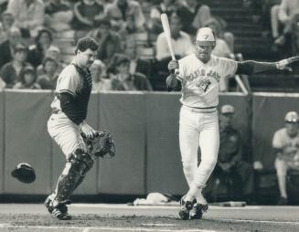 Where's the ball? New York Yankees catcher Rick Cerone has his cap and mask off but he seems uncertain as to where this wild pitch from Tommy John has(...)