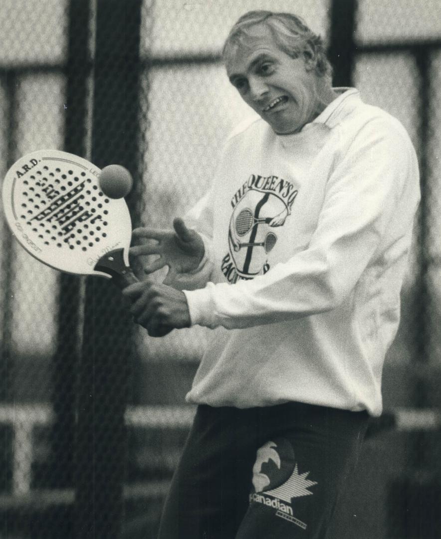 Tennis with a twist: Toronto's Keith Carpenter flashes his championship form in the gentelmanly but highly competitive sport of platform tennis at the Queen's Quay Racquet Club