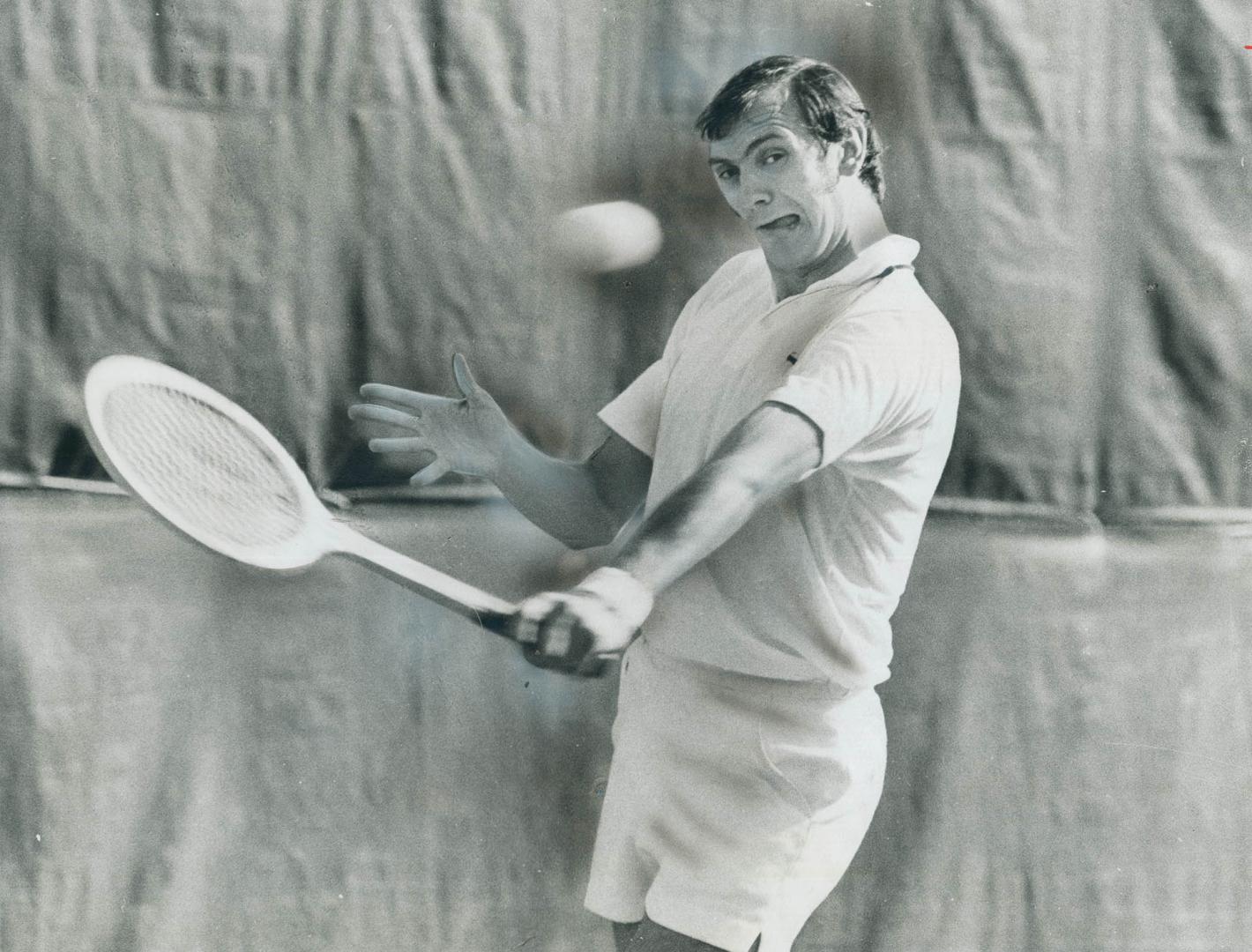 Keith Carpenter, former member of Canada's Davis Cup team, takes vicious swing at ball