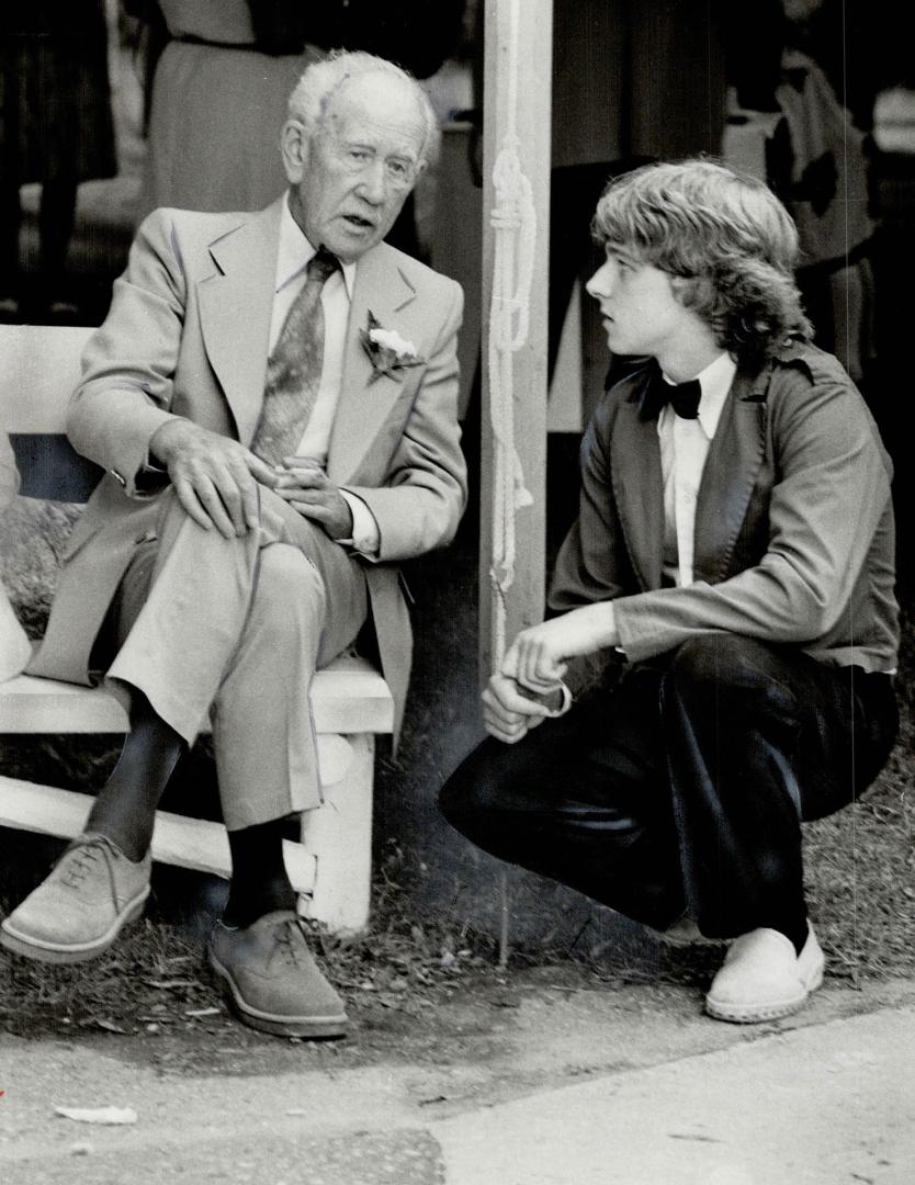 A. J. Casson, last living member of the Group of Seven artists, discusses Algonquin Park with 19-year-old Trevor Moffat, a Guild Inn employee