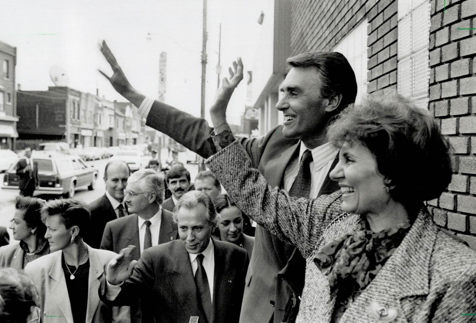 Warm Welcome: Portuguese Prime Minister Anibal Cavaco Silva and his wife, Maria, wave to fans as they arrive at Metro's Vasco da Gama Community Club