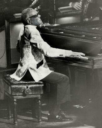 The Genius: Ray Charles performed for a black tie audience at Metro Convention Centre last night and had them clapping along to his version fo 'Rudolph The Red-Nosed Reindeer'