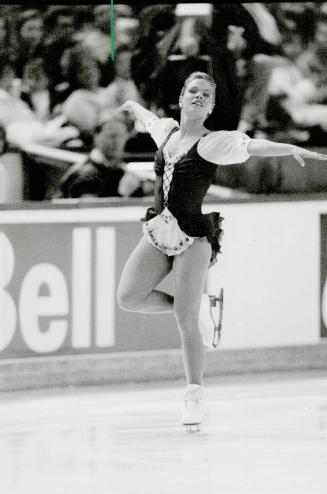 Poised for victory: Josee Chouinard's winning smile and athletic performance captivated the crowd of 15,800 at Copps Coliseum