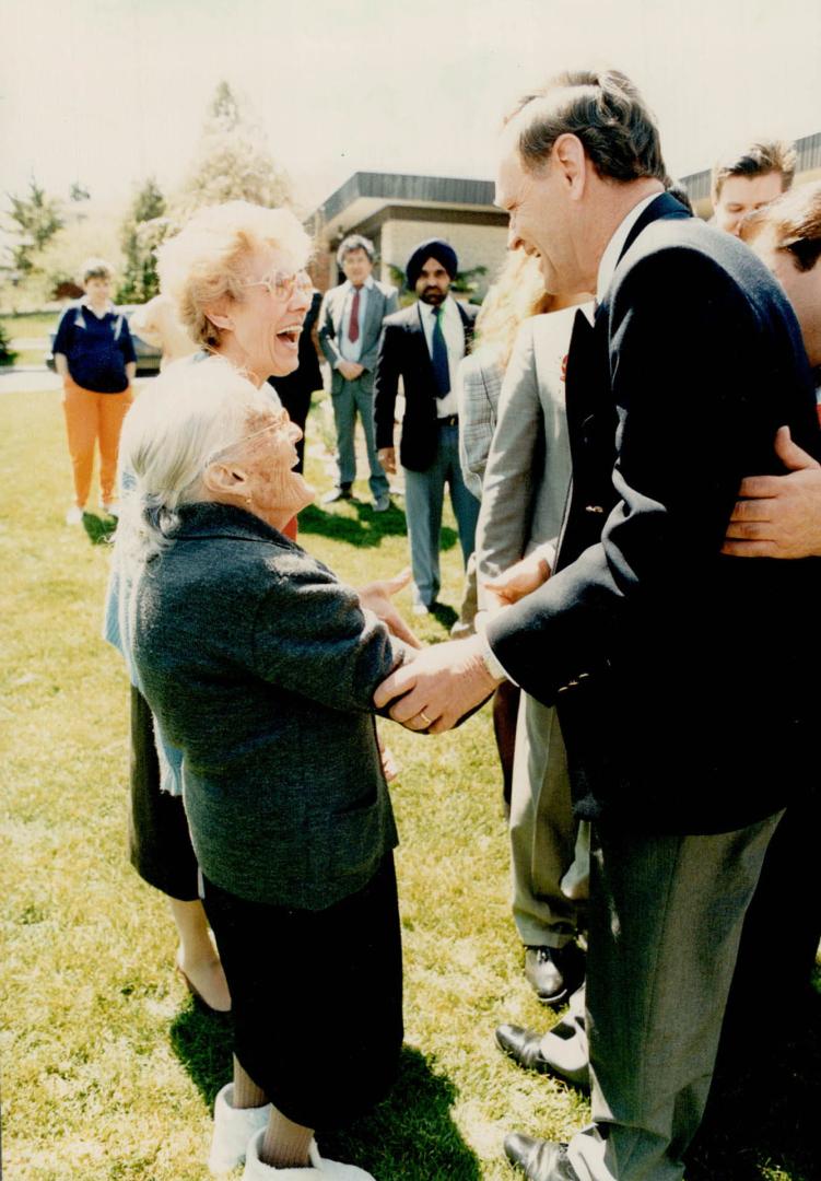 So pleased to meech you. Jean Chretien greets Antonia Vetese, front, and Maria Baldussi at a Metro party yesterday, where the Liberal leadership candidate ralled against Meech Lake