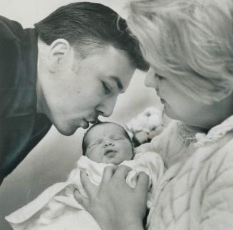 . . . But Can She Counter-Punch? There's no heavyweight champion potential here. Canadian boxing champion George Chuvalo views his new daughter, Vanes(...)