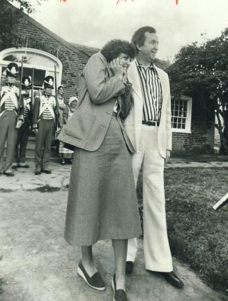 Maureen McTeer covers ears as Fort York cannon is fired during a visit with her husband, Conservative Leader Joe Clark