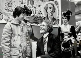 Jimmy Lam, 13, talks with actor Robert Christie, who portrayed Canada's first prime minister at a birthday celebration