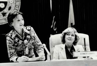 Kennedy Lodato, 14, plays mayor yesterday while the real mayor, Gayle Christie, looks on