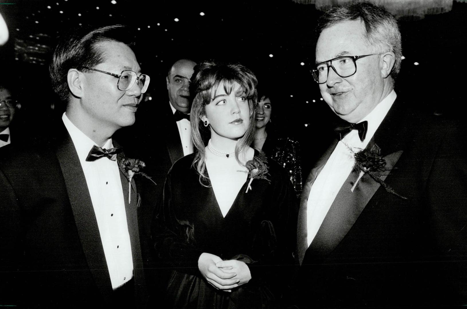 New year gala: Dr. Joseph Wong, left, chats with Constitutional Affairs Minister Joe Clark and daughter Catherine at Westin Harbour Castle Hotel last night