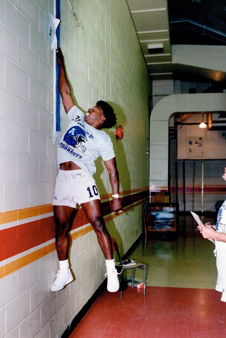 Tale of the tape. Argo Mike (Pinball) Clemons, who has sprouted to 5-foot-5 1/2 in the off-season, tests his vertical leap in training camp yesterday in Guelph