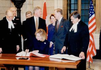 Hillary Clinton signs guest book in Ottawa