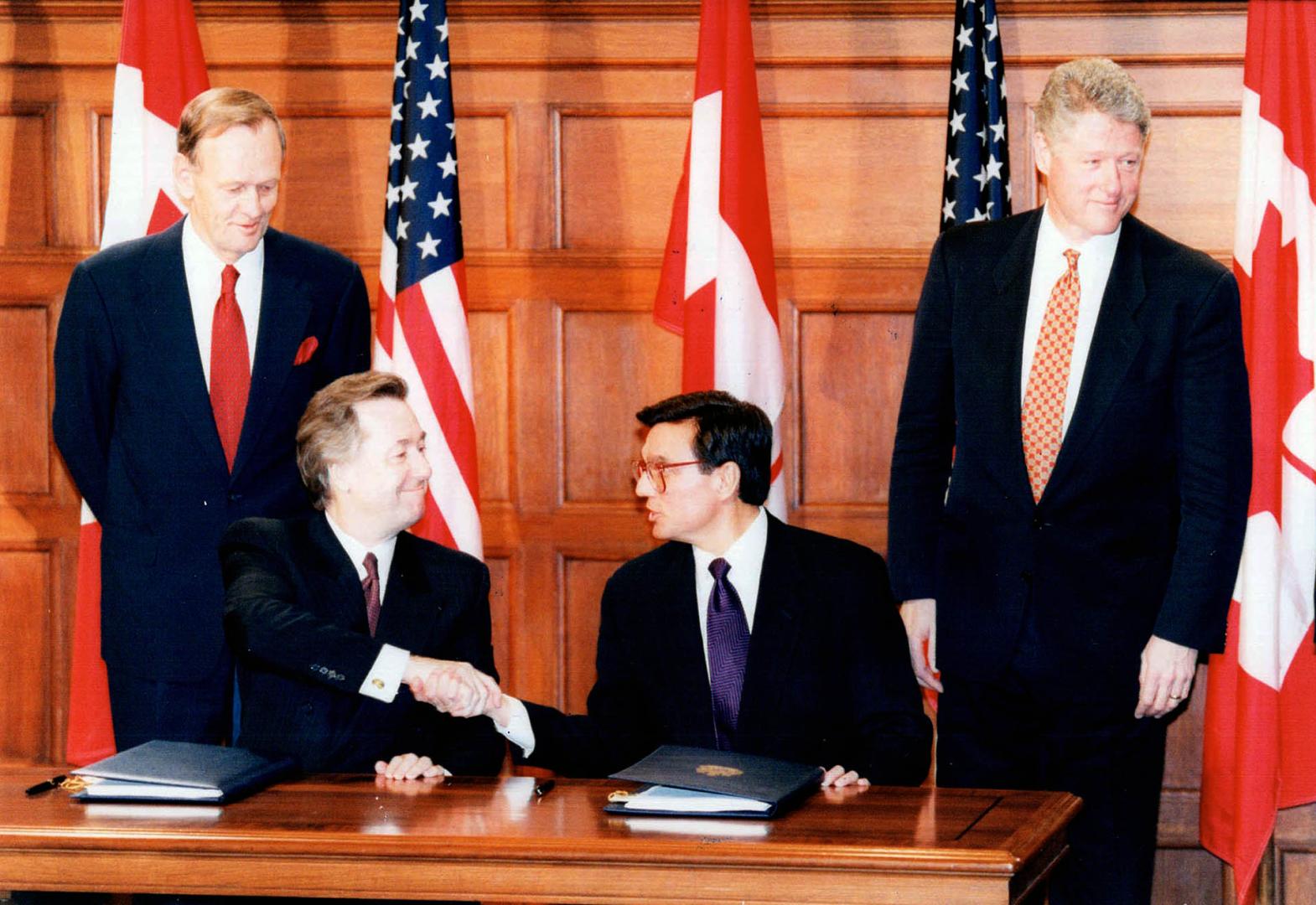 Standing (Jean Chretien, Bill Clinton) seated {Dauglas Young and Federico Pena}