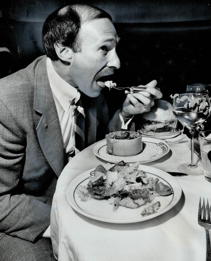 Equally nutritious, but differing on the taste scale, are these meals sampled by George Cohon (left) president of McDonald's Restaurants, and John Are(...)