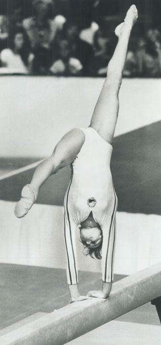 Perfect smile: Nadia's work on the beam yesterday won her perfect 10 points, as did her brilliant tricks on the uneven bar earlier in the competition