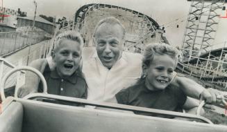 Luckiest kids in the world yesterday were Joe Meunier, 9, left, and Barry Wilkins, 7, right, who were chosen by Patty Conklin, CNE midway impresario, (...)