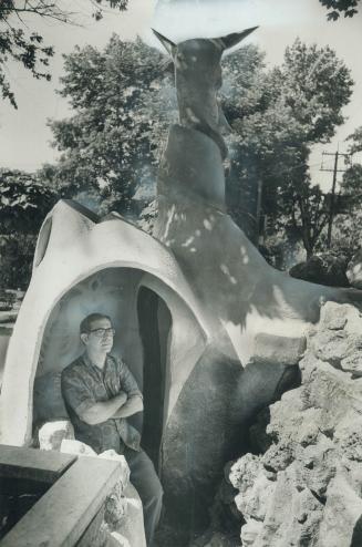 Toronto artist oine Corege poses with his sculpture, Neptune, the city says must vacate his front lawn because really a structure. Corege, who lives a(...)