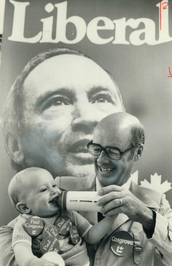 Candidate Paul Cosgrove feeds 7-month-old Matthew Gilmore a diet of milk and politics