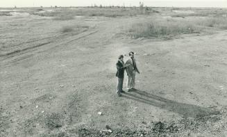 Aldermen Gordon Cressy, left, and Michael Burns at site for possible new industrial park at the foot of Leslie St