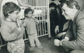 Popsicles take priority over officials with two young patients at doomed Doctors Hospital yesterday as Mayor David Crombie toured building at request (...)