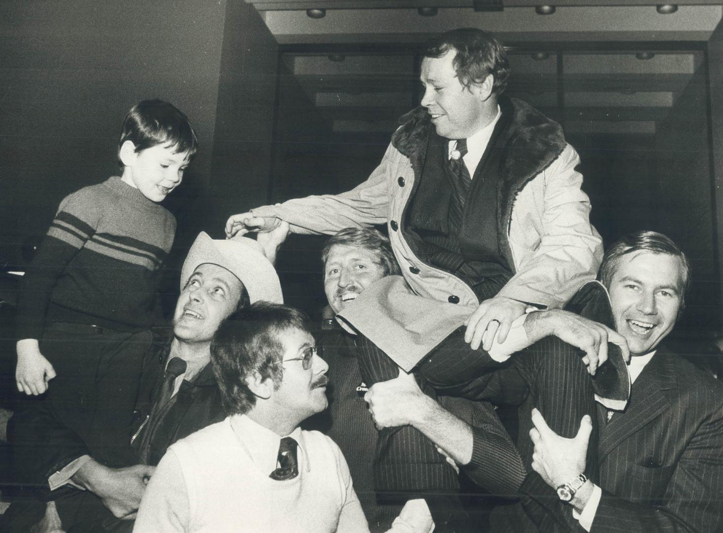 David Crombie. Mayor David Crombie riding on the shoulders of his campaign workers he was carried into the St. Lawrence Market Hall where his victory celebrations were held