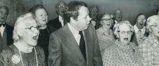 Toronto Mayor David Crombie takes a break in a 16 hour work day at a senior citizens sing-along